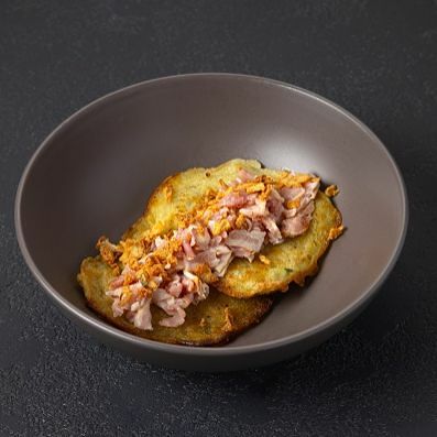 Драники с беконом и луком фри в Pelmen House по цене 340 ₽