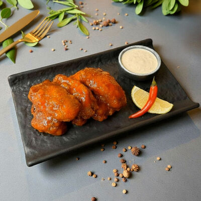 Острые куриные крылья с соусом тартар в В Питере пить по цене 805 ₽