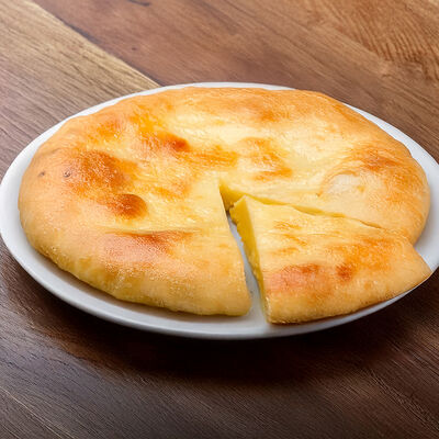 Осетинский пирог в Кафе хачапури по цене 810 ₽