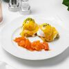 Кабачковые оладьи с лососем, яйцом всмятку и соусом голландез в Eclair по цене 920