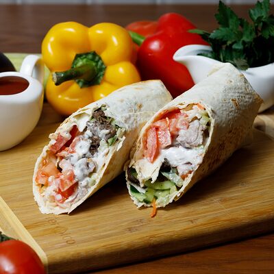 Шаурма с томленой говядиной в афганском казанев Kazan Kebab по цене 500 ₽
