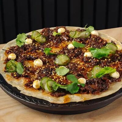 Лепешка роти со рваной говядиной в Tsunami по цене 750 ₽