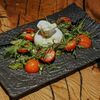 Буррата с томатами конфи и хлопьями морской соли в Rekki Pizza & Cocktail Bar по цене 1490