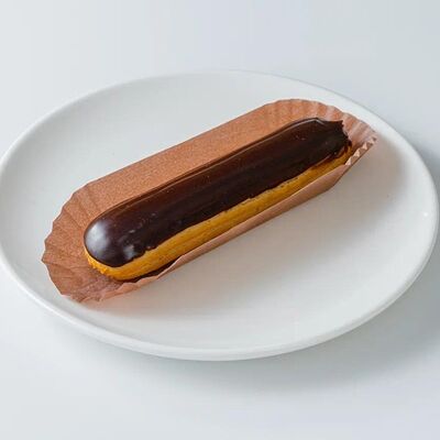 Эклер шоколадный в Волконский по цене 290 ₽