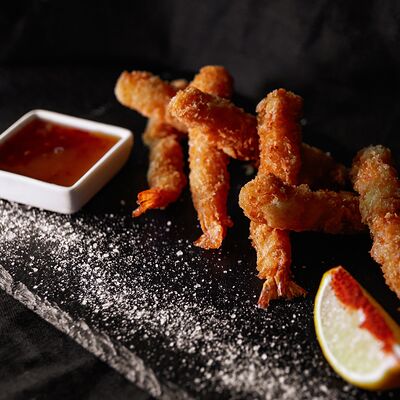 Креветки темпура в кокосовой стружке в Атлантида по цене 840 ₽