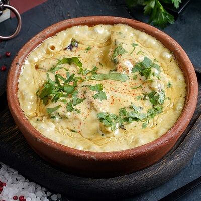 Чкмерули с курицей в Долма по цене 490 ₽