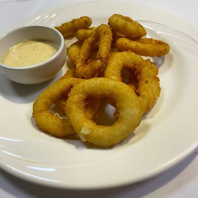 Луковые колечки в Первая реберная Кухня по цене 280 ₽