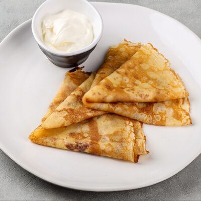 Блины со сметаной 2 шт в Томаго по цене 270 ₽