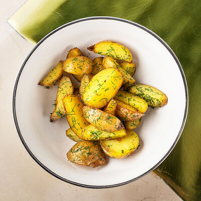 Картофель бейби с чесноком и зеленью в Муссоны по цене 250 ₽