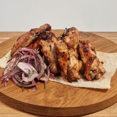 Крылышки куриные на мангале в Золотая вилка по цене 435 ₽