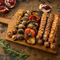 Логотип Вкусно есть всё на углях