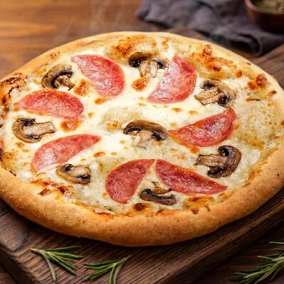 Пицца с ветчиной и грибами в Мама Испекла по цене 740 ₽