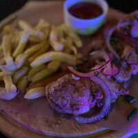 Шашлык куриный с картофелем фри и соусом аджика в Studio 46