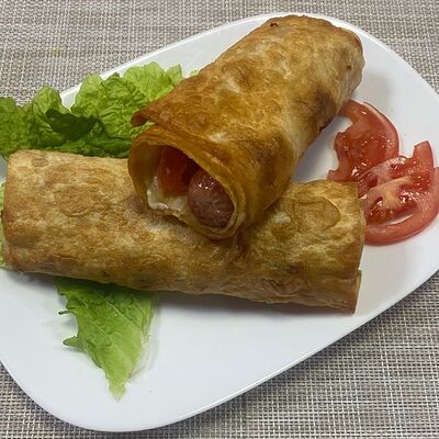 Сосиска в лаваше с сыром и помидором в Ёмоё по цене 160 ₽