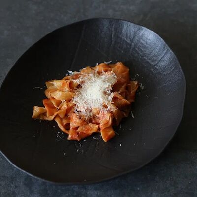 Паста с томатным соусом и пармезаномв KOKK по цене 590 ₽