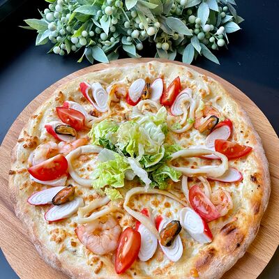 Пицца с морепродуктами в Caramel по цене 735 ₽