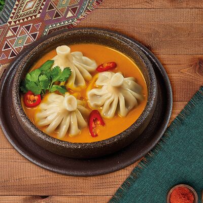 Хинкали в соусе том ям в Деда хинкали по цене 860 ₽