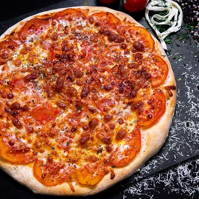 Пицца Маргарита в Жарим на углях по цене 850 ₽