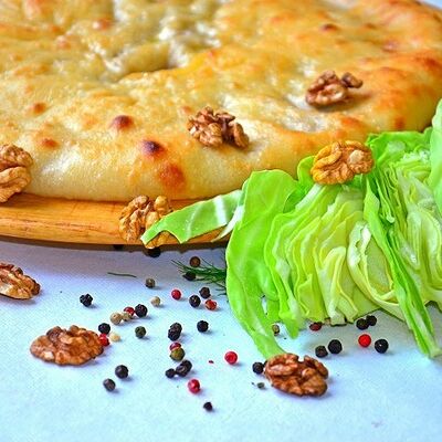 Осетинский пирог с капустой и грецким орехом в Осетинские пироги от Забавы по цене 1200 ₽