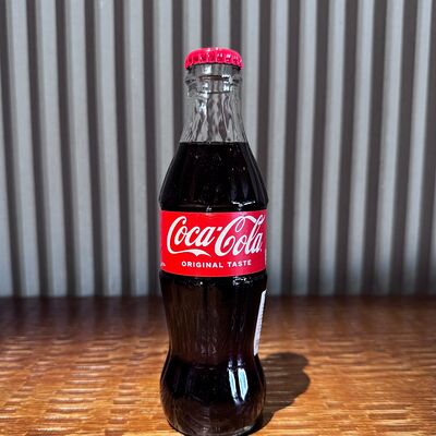 Coca - Cola 250мл в KOJI по цене 450 ₽