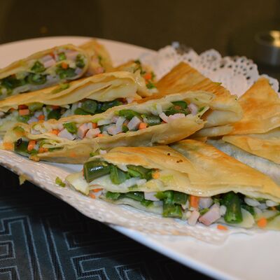 Лепешка с фасолью, ветчиной и рисом в Тан чао по цене 20 р.