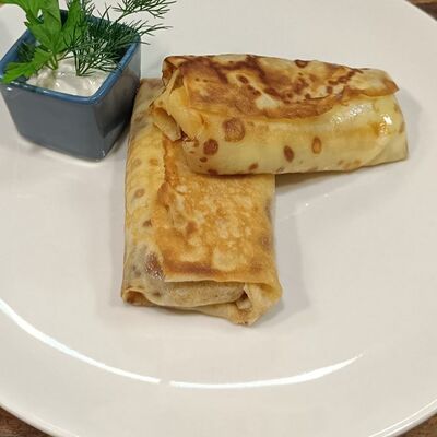 Блинчики с ветчиной, сыром чеддер и моцареллой в Parmi restaurant & pizzeria по цене 397 ₽