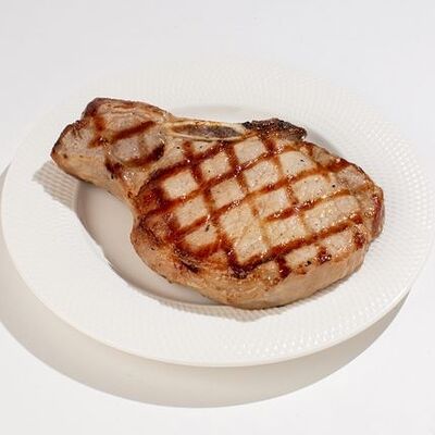 Стейк из свинины на косточке в Му-Му по цене 520 ₽