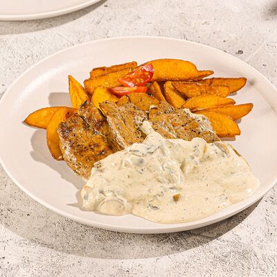 Медальоны из свинины под сливочно-грибным соусом в Stories по цене 599 ₽