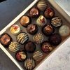 Пирожные со сливочной начинкой в шоколаде ассорти L в Marys Cakes по цене 2890
