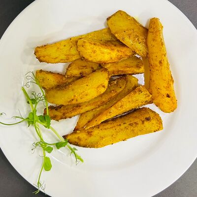 Картофель запеченный в специях в Рябинушка по цене 195 ₽