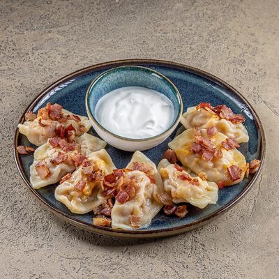 Вареники с тушеной капустой и беконом в Тестория по цене 300 ₽