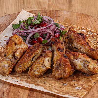 Шашлык из куриных крыльев в Чайхана тандыр по цене 400 ₽