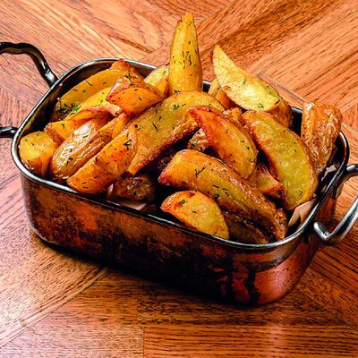 Картофель по-деревенски в Гриль-бар Бикью по цене 290 ₽