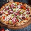 Пицца с нежным ростбифом су-вид в Mama Roma по цене 715