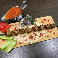 Шампиньоны на углях с курдюком в Маэстро