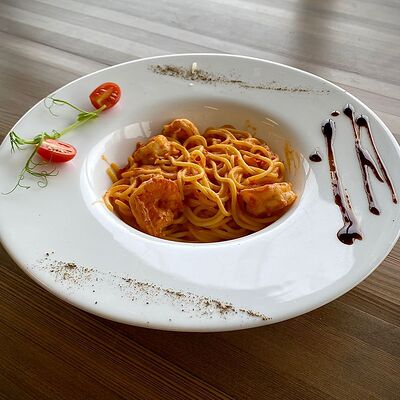 Спагетти с креветкамив Rigatoni по цене 569 ₽