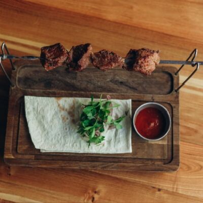 Шашлык из свинины в Мацони по цене 790 ₽