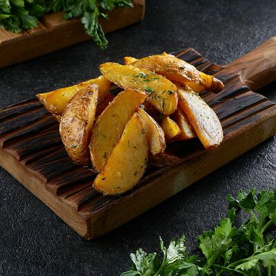 Картофельные дольки с чесноком и травами в Sofa&par по цене 160 ₽