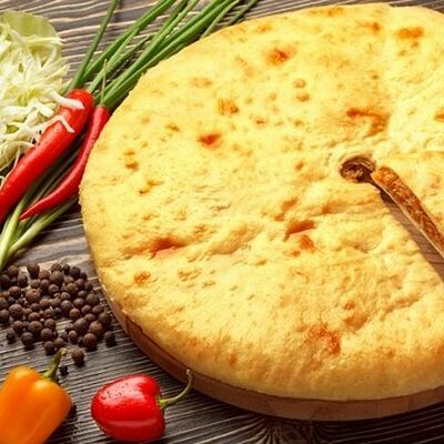 Осетинский пирог с капустой и зеленым луком в Осетинские пироги от Забавы по цене 1100 ₽