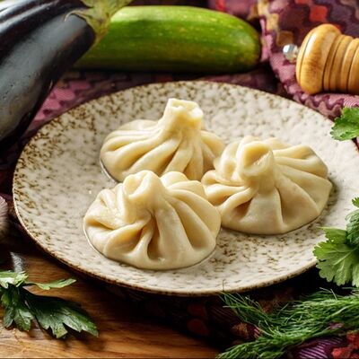 Хинкали с томатами и сыром в КинZa-Dза по цене 360 ₽