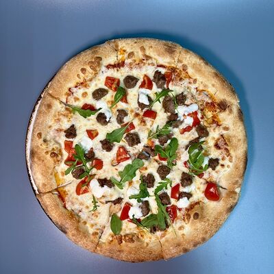 Пицца Мясная в Парнас по цене 780 ₽