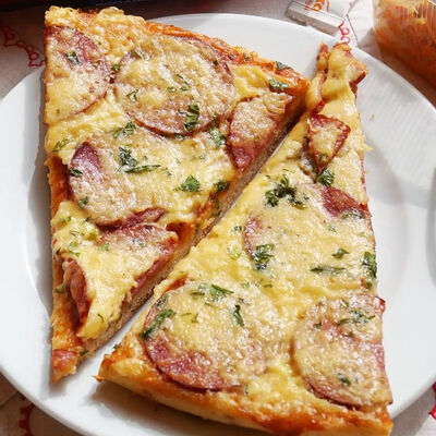 Пицца Студенческая (кусочек) в Дока пицца по цене 150 ₽