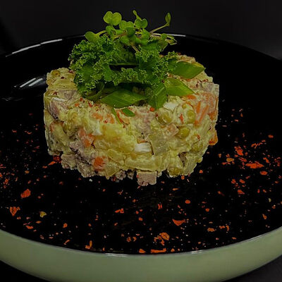 Салат Оливье с говяжьим языком в Ostroff по цене 190 ₽