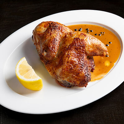 Курица на вертеле с соусом из зеленого перца в Dacha restaurant по цене 1080 ₽