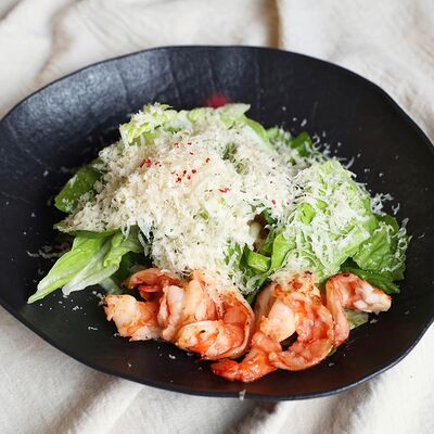 Салат Цезарь с креветками в KOKK по цене 690 ₽