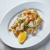 Жареные кальмары с чесноком и розмарином в Romano по цене 800