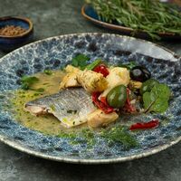 Филе окуня по лигурийски с артишоками, оливами и каперсами в Ресторан Da Cicco