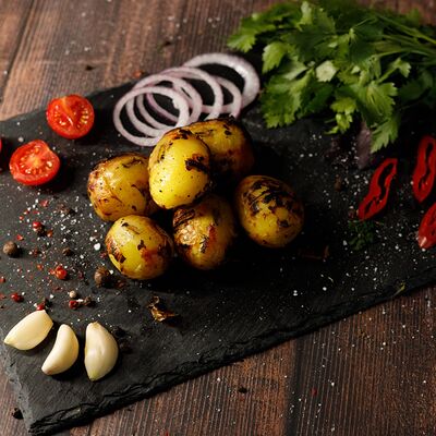 Картофель молодой на мангалев Шафран мясо&хаус по цене 350 ₽