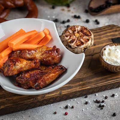 Куриные крылья в соусе барбекю в Мясоед по цене 750 ₽