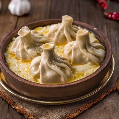 Хинкали с сыром в сливочно-сырном соусе в Каретный дворик по цене 850 ₽